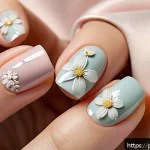 Home 21 봄맞이 플라워 네일 디자인 - A close-up of a feminine hand displaying minimalist floral nail art, featuring small delicate flower...